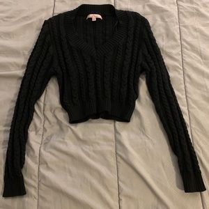 Cropped black sweater.